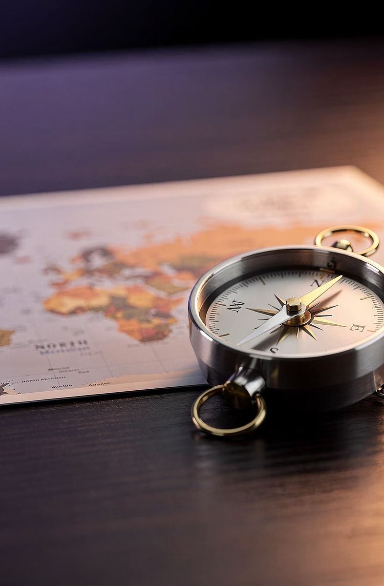 Compass resting on a world map